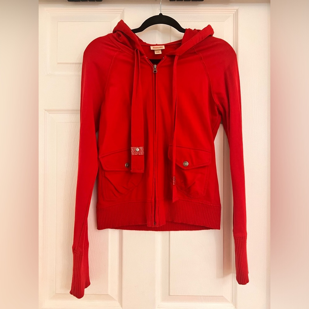 Red lightweight cotton hooded jacket.